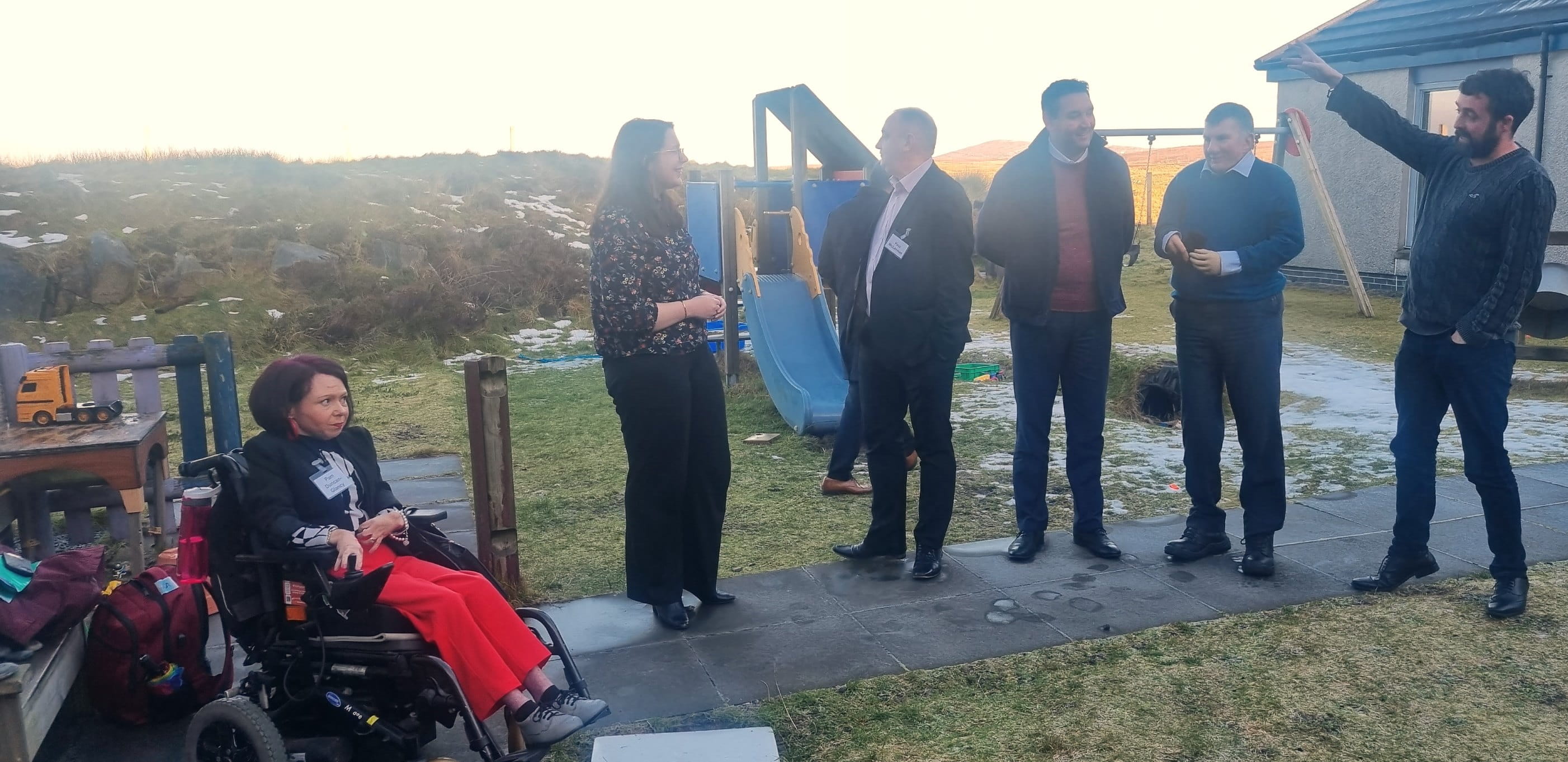 Committee Members visiting the play area of Cothrom